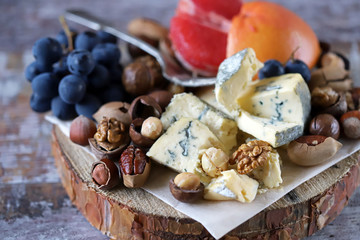 Blue cheese with fruits and nuts. Cheese Set. Healthy food.