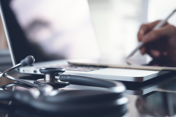 Doctor working on laptop computer