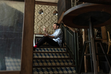 Fototapeta premium Restaurant, cafe, bar closed due to COVID-19 or Coronavirus outbreak lockdown, stressed owner of small business, depression. Businessman exhausted, upset. Business, economy, finance crisis.