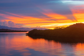 Sunrise over mangrove island in calm bay of Bocas Del Toro, Panama