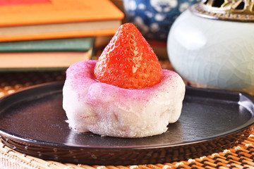 Strawberry Daifuku on black tray  