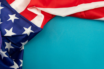 Fototapeta na wymiar American Flag on blue background with copy space for your text.