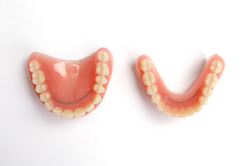 Top view of complete denture on white background
