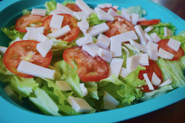 fresh salad with tomatoes and lettuce