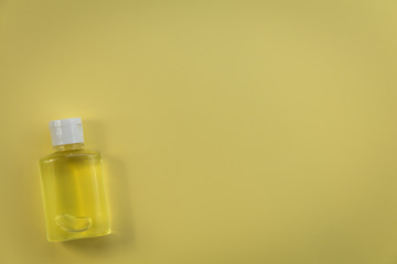 Hand Sanitizer mini travel size no label yellow copy space flat lay