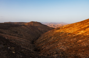 Panoramic view at volcanic landscape nearby Pajara on canary island Fuerteventura. Sunset in october 2019
