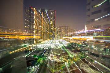Fototapeta na wymiar Blurred abstract background of light lines from the capital's residences in condominiums, offices, street lights from shopping malls, nighttime beauty