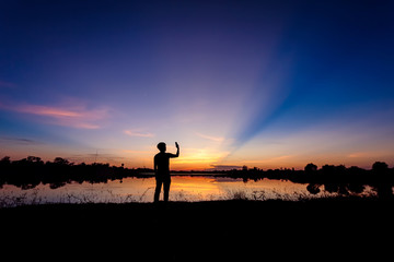 Man makes selfie shot at sunset