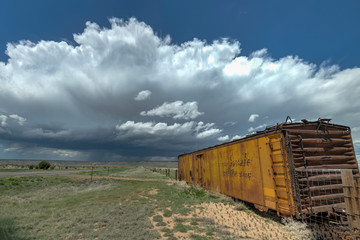 Fototapeta na wymiar Summertime Storms on the Great Plains with Boxcars