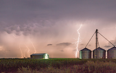 Dramatic Lightning Storm Over a Farm on the Great Plains During Summertime