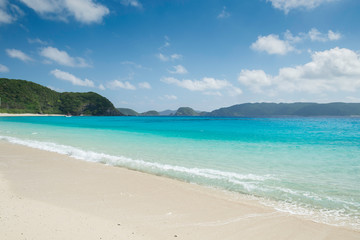 Fototapeta na wymiar Tropical beach with turquoise water on the beautiful island of Zamami.