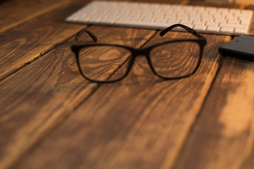 Glasses for sight and vision correction and protection from computer on the wooden table