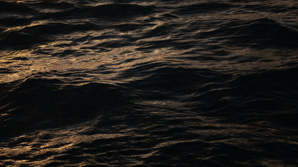 Sunset on ocean waves