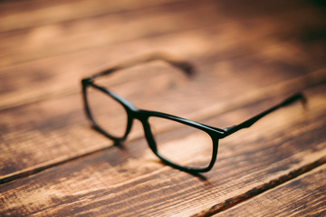 Glasses for sight and vision correction and protection from computer on the wooden table