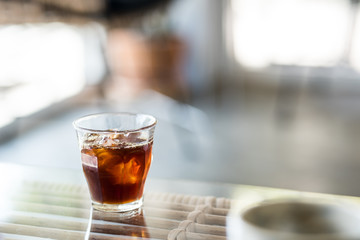 A cup of ice americano in coffee shop.