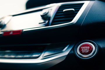Plakat engine start/stop button in modern car, filter effect, selective focus