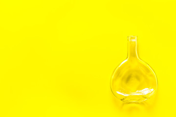 Bottle for recycling on yellow background top view copy space