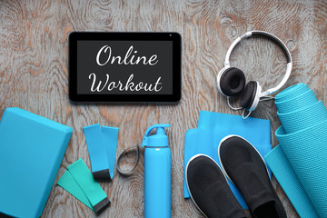 Fitness or yoga background. Equipment for online home training. Top view. Flat lay