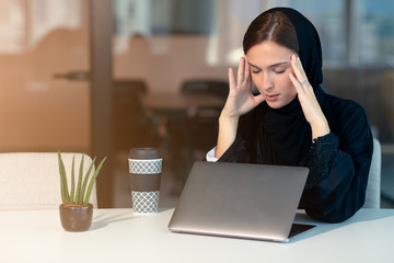 professional young female muslim worker having problem