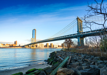 Manhattan bridge with lower Manhattan skyline of downtown New York, Brooklyn Bridge and Manhattan...