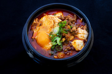 Korean spicy silken tofu stew which is called Sundubu Jjigae