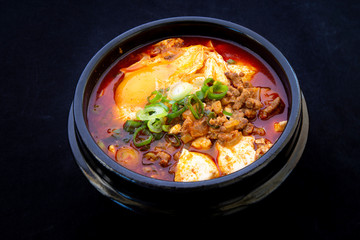 Korean spicy silken tofu stew which is called Sundubu Jjigae