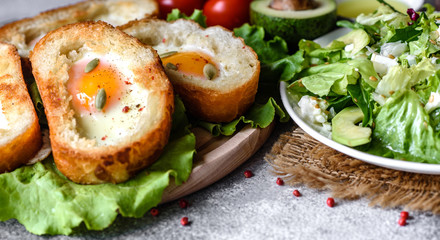 Delicious breakfast with grunts, eggs, avocado and cherry tomatoes