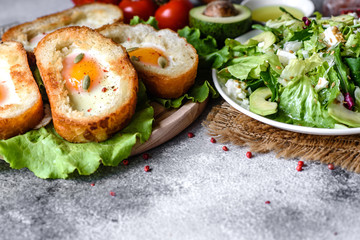 Delicious breakfast with grunts, eggs, avocado and cherry tomatoes