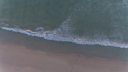 Aerial sea wave on the beach over sunset - 341883159