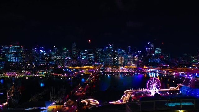 A night timelapse of panoramic bayarea at Darling harbour in Sydney high angle wide shot tilt