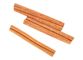 Three cinnamon sticks isolated on a white background, top view. Cassia.