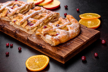 Delicious fresh pie baked with apple, pears and berries