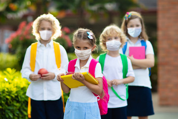 School child wearing face mask. Virus outbreak.