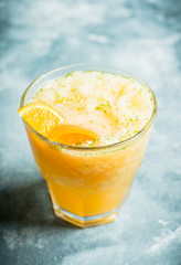 Old fashioned orange cocktail on rustic background. Selective focus. Shallow depth of field.