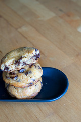Soft and chewy chocolate chip cookies on a wooden table