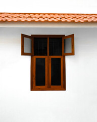 window on the house with roof