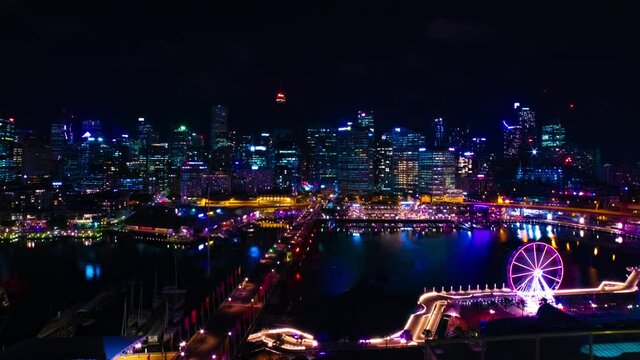 A night timelapse of panoramic bayarea at Darling harbour in Sydney high angle wide shot zoom