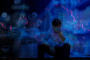 Fototapeta na wymiar The business financial crisis and economic crisis from Coronavirus business worker feeling sad, representing Stressed about investment in a stock market global epidemic crash by the COVID-19