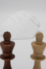 Ffp2 mask. Chess, direno. Humanity's fight against the virus.
