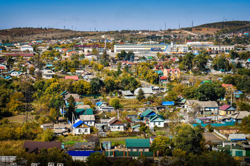 View of the city of Ussuriysk from a height © Tishina