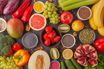 Healthy food clean eating selection: fruit, vegetable, seeds, superfood, cereals, leaf vegetable. Ingredients for the healthy foods selection. Background food.