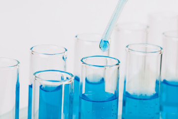 A pipette that adds fluid to one of several tubes. Lab tests