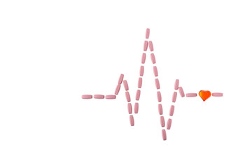 Pills in shape of cardiogram pulse on white isolated background. Vitamins and red glass heart, symbol of healthy lifestyle. Pharmaceutical and cardiology concept. Heartbeat rhythm made of tablets