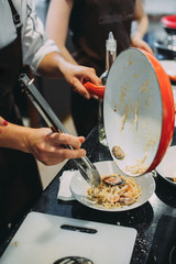 Cooking pasta with seafood in a cooking class. Italian pasta with seafood. Mussels