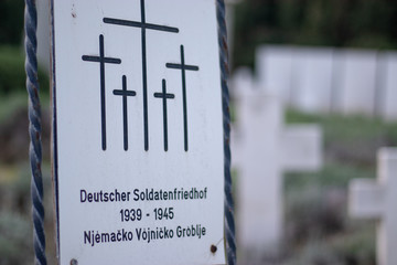 Inscription on german and croatian language for a graveyard of german soldiers fallen in world war 2