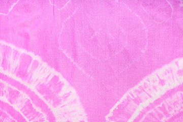fragment of abstract ornament of pink scarf