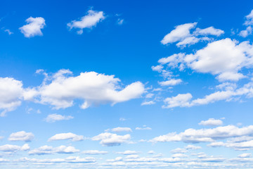 blue sky with many white small cumulus clouds