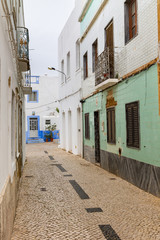 Fototapeta na wymiar Narrow alley in the old town in Olhao, Algarve, Portugal.