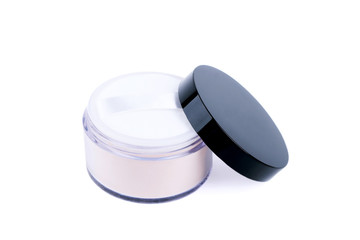 Cosmetic beige powder in a jar isolate