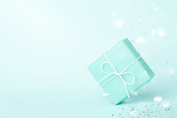 Turquoise gift box with sparkles.